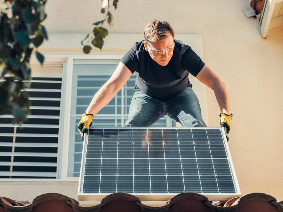 a person installing solar panels