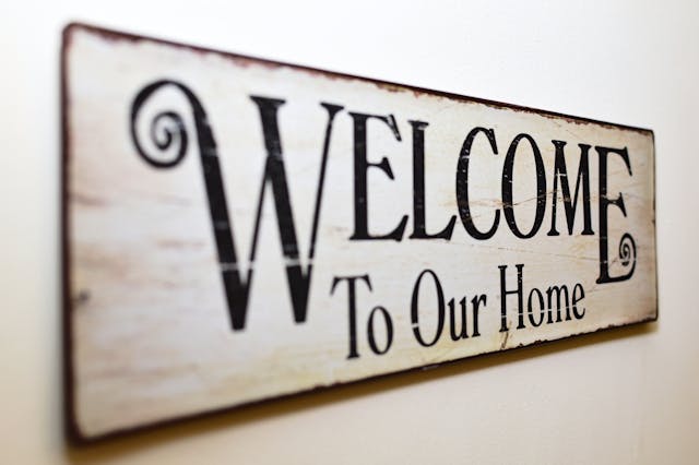 wooden welcome sign.